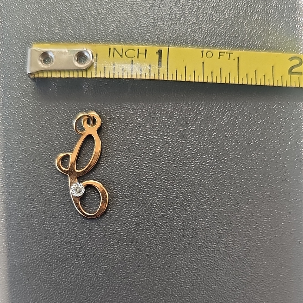 Elegant Gold Pendant with Crystal Accent